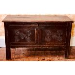 A Charles II oak blanket chest, circa 1660, rectangular moulded edge hinged lid, two carved panels