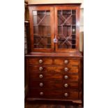 A George IV mahogany secretaire bookcase, circa 1825, moulded cornice above twin astragal glazed