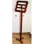 A Regency mahogany music stand, circa 1820, serpentine bar pieced top with  height adjustable