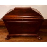 A Regency mahogany sarcophagus shaped cellarette, circa 1810, hinged cover top, on panel front and