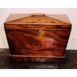 A George III mahogany sarcophagus shaped cellarette, circa 1800, hinged top enclosing led