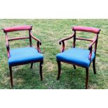 A pair of Regency mahogany carver chairs, circa 1815, curved reeded tablet backs, scroll arms,