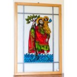 A contemporary leaded stained glass window depicting a Saint holding and infant with an orb, 84 by