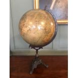 A Philips' Terrestrial table globe, on a cast iron tripod base, George Philip & Son Ltd, 32 Fleet