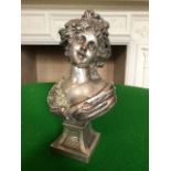 An Art Nouveau silvered copper bust of a young lady, circa 1890, hair up with a leaf headdress and a