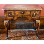 A George I revival walnut low boy, slight oversailing moulded edge top, above one frieze drawer