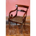 A William IV rosewood armchair, circa 1830, bar top rail, acanthus carved splat, scrolling armrests,