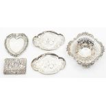 Five items of dressing table and small silver, to include a pierced bon bon dish, a pair of cherub