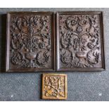 A pair of early carved oak panels, probably 17th Century, each carved in relief with a vase of