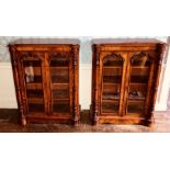 A pair of Victorian figured walnut pier cabinets, circa 1850, rectangular moulded edge top, above