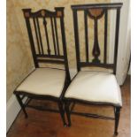 A pair of similar Edwardian ebonised chairs, circa 1910, inlaid with satinwood and marquetry on