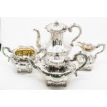 A mid Victorian silver four piece tea set, melon shapes with gilt interiors, fruit finials,