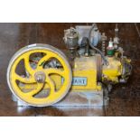 A vintage engineered Stuart horizontal live steam engine, painted yellow, width 40cm