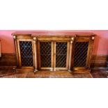 A Regency rosewood low level breakfront library bookcase, circa 1820, slight oversailing top gilt