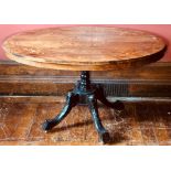 A Victorian figured walnut oval tilt top loo table, circa 1860, quarter veneered marquetry inlaid