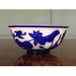 A Chinese cameo glass bowl, 20th Century, translucent white glass overlaid with blue to form