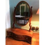 A George III mahogany and barbers pole strung toilet swing mirror, circa 1800, oval plate,
