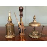 Vintage brass desk equipment, to include a spring operated desk stamp, a summons bell and a Pigeon