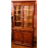 An Edwardian mahogany bookcase, circa 1905, dentil cornice, double glazed doors opening to height