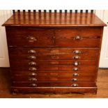 A late 19th Century grained pine plan chest, circa 1890, rectangular moulded edge top, above twin