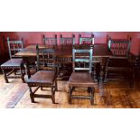 A set of six 20th century oak dining chairs and one carver by Nigel Griffiths of Matlock (signed