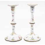 A pair of mid 18th Century Battersea enamel candlesticks, circa 1750, bobeches, knopped stems,