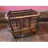A mid Victorian figured walnut canterbury, circa 1860, triple section with baluster turned supports,