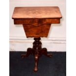 A Victorian figured walnut and satinwood work table, circa 1850, rectangular hinged top enclosing