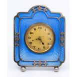 An Art Deco desk or bedside easel timepiece, pierced silver frame, blue guilloche ground, maker