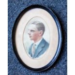 British School, early 20th Century, portrait miniature of a handsome young man, bust length in