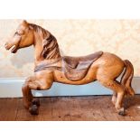 A 19th Century French pine carved carousel Horse. 90cm H