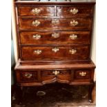 A mid 18th Century Welsh oak chest on stand, circa 1760, crossbanded throughout, the upper section