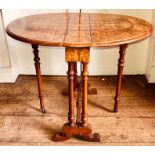 A late Victorian burr walnut Sutherland table, circa 1890, oval drop ends, baluster turned columns