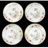 A set of four Chinese porcelain plates, Qianlong, painted in the famille rose palette with an exotic