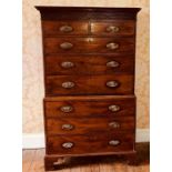 A George IV mahogany chest on chest, circa 1825, moulded cornice over a fretwork frieze, above two