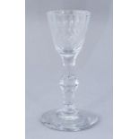 An 18th Century clear glass wine, circa 1785, facet cut bowl and single knop stem, ground pontil,