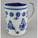 An early nineteenth century blue and white hand-painted cabbage-leaf moulded mug, c. 1800-1810. It