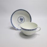 A Worcester Blue and White Ribbed Tea Cup and Saucer, painted in the centre with The Dark Sprig