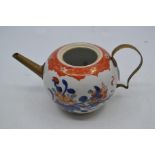 An eighteenth century Chinese porcelain Imari bullet-shaped teapot with tinker-type brass spout