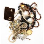 A collection of costume jewellery including necklaces, pearls, rings, yellow metal items, watches,