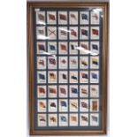 Kensitas cigarette silks of British Empire Flags, 48 in glazed and gilt frame. 30 x 18 inches.