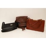 Three ladies handbags, to  include a 1960's structured tan faux leather handbag along with a two