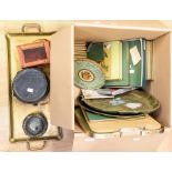 A collection of trays, mats, stands etc including a carriage clock box