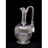 A Georgian decanter with etched vine decoration to the body, star cut base and facet cut neck.