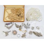 A collection of costume jewellery to include a vintage paste set coronet brooch, a silver and