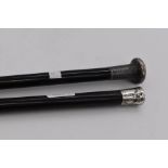 Two silver topped Edwardian walking canes, ebonised sticks