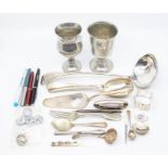 A collection of small silver items including silver plate; cutlery, pedicure items, pens, rolled
