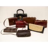 A collection of handbags, to include a small red snake skin effect leather structured bag, along