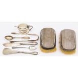 A group of silver to include: pair of Edwardian silver mounted brushes, engine turned with central