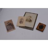 A photograph of three gentlemen, by J.G Tunny (Edinburgh), an ambrotype of a young boy, possibly